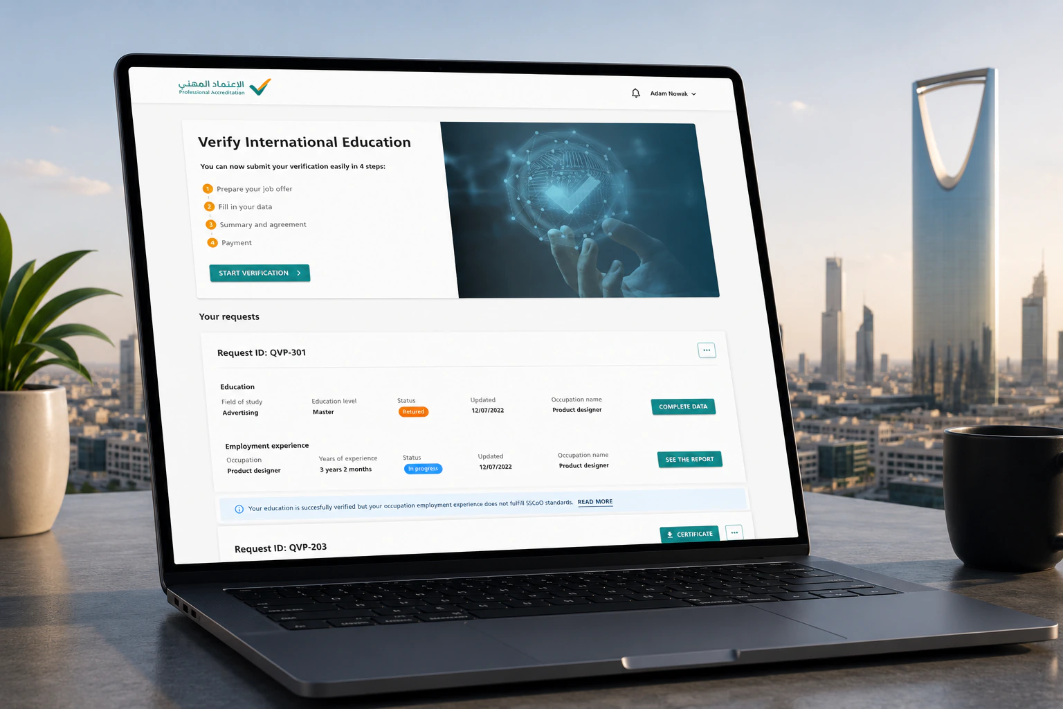The Qualification Verification Platform shown on a laptop against the Riyadh skyline – the Professional Accreditation dashboard with a 'Verify International Education' hero and a list of verification requests